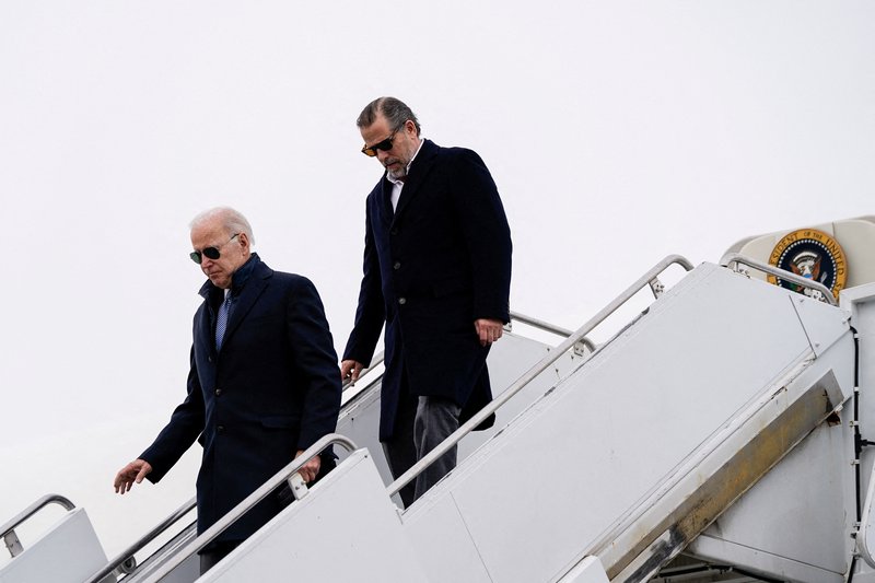 U.S. President Joe Biden and son Hunter Biden disembark from Air Force One at Hancock Field Air National Guard Base.