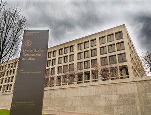 The exterior of the Frances Perkins Building, the headquarters of the US Department of Labor, on a cloudy day in Washington, DC.