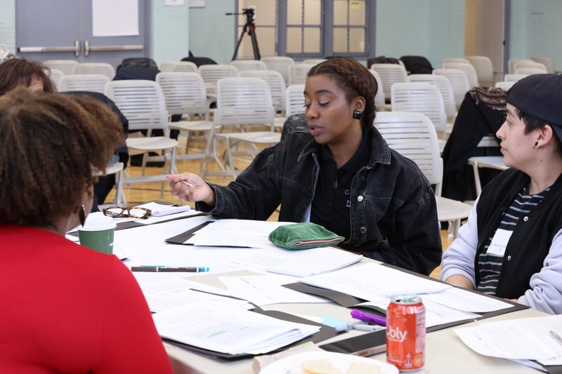 People participating in a group activity, having discussion.