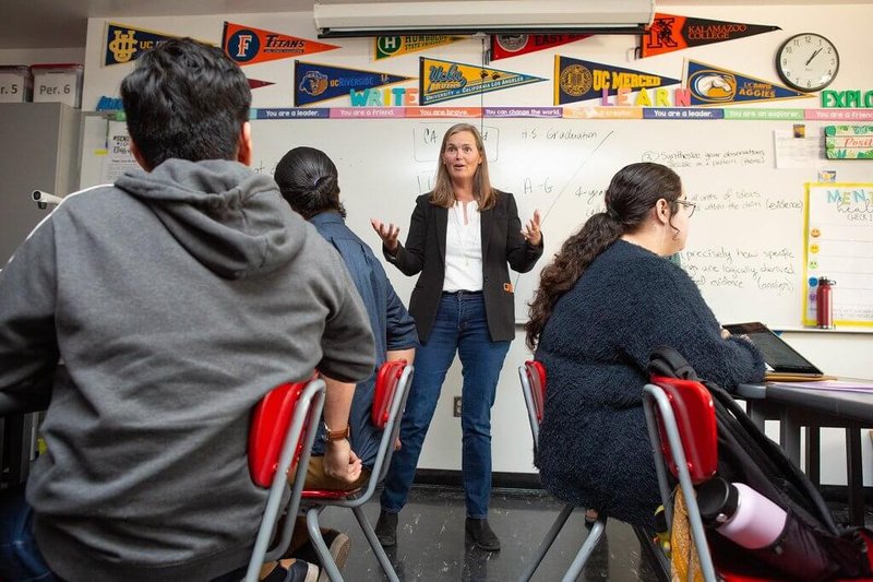 Teacher leads high school research class