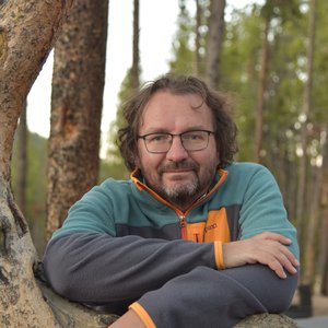 Headshot of New America contributor Ezra Rosser