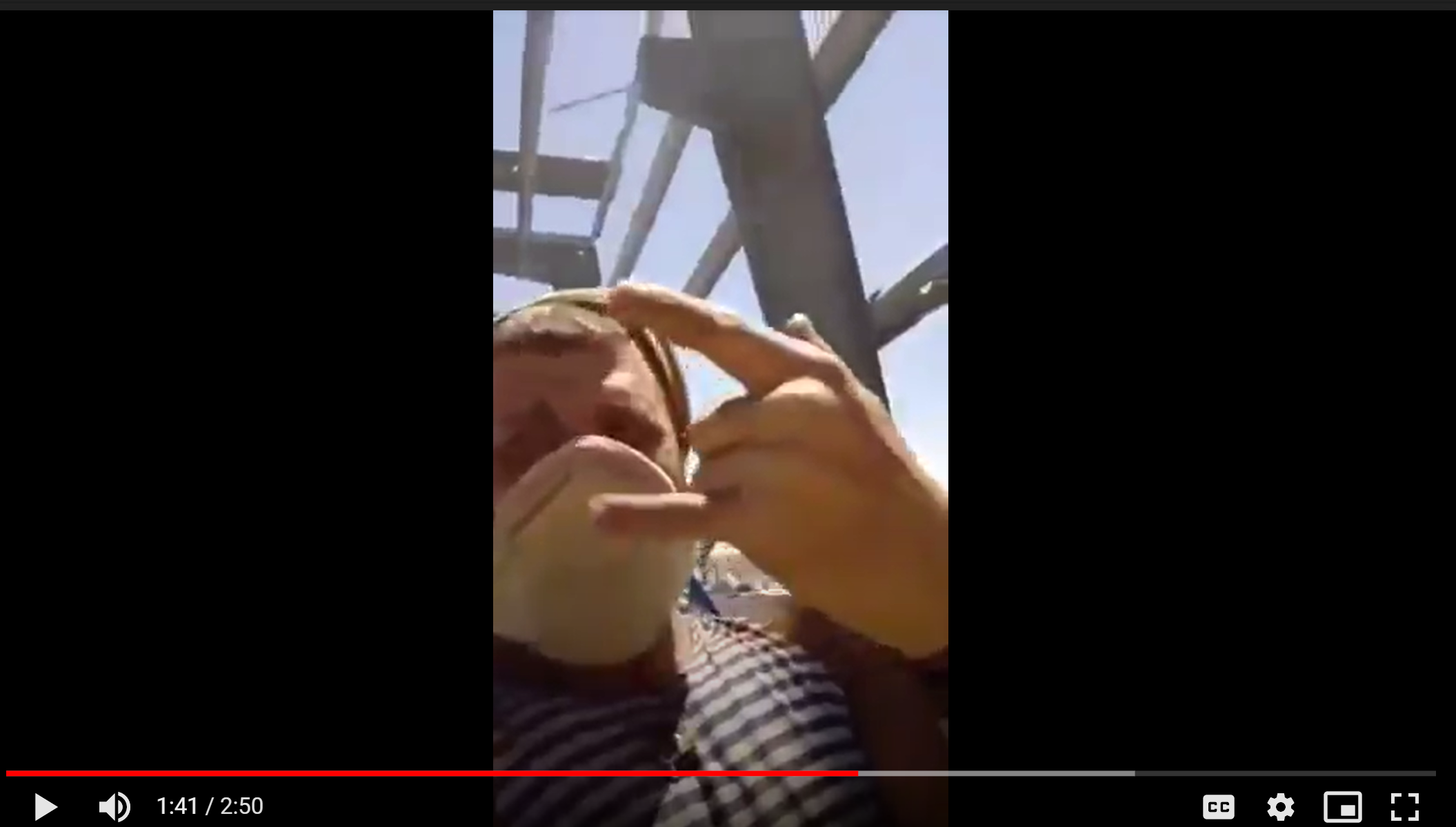 Figure 5: Still from Video D (Immolation) of one of the assailants who burned the victim's body. 