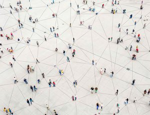 Aerial view of a plaza with people and intersecting lines forming a network pattern.