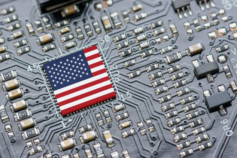 A flag of the United States sits in a chip used for AI technology.
