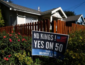 A “Yes on 50” sign is posted in front of a home in San Anselmo, California.