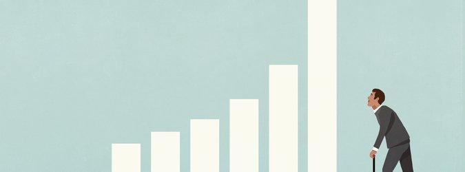 A man pumps up a bar in a bar graph with an air pump.