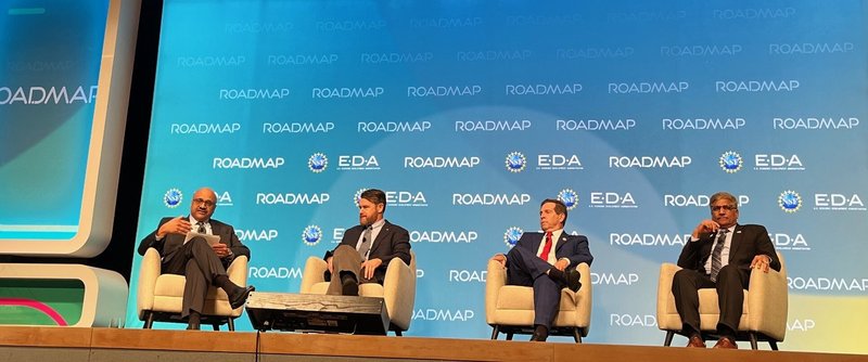 Four panelists sit on stage at the ROADMAP Summit, hosted by NSF and EDA. A backdrop displays 'ROADMAP' and agency logos.