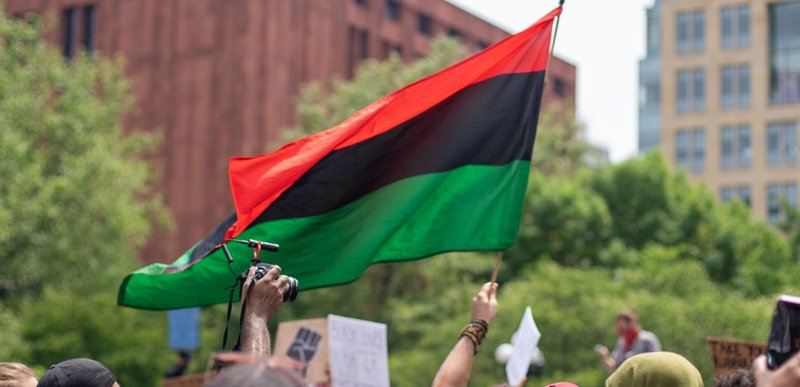 African American emancipation flag flying at a Black Lives Matter protest.