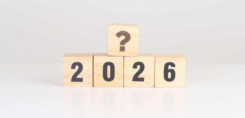 Light-colored wood blocks with the numbers 2026 and a question mark