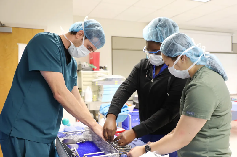 Students in Durham Technical Community College's surgical technology program arrange the instruments they work with during class.