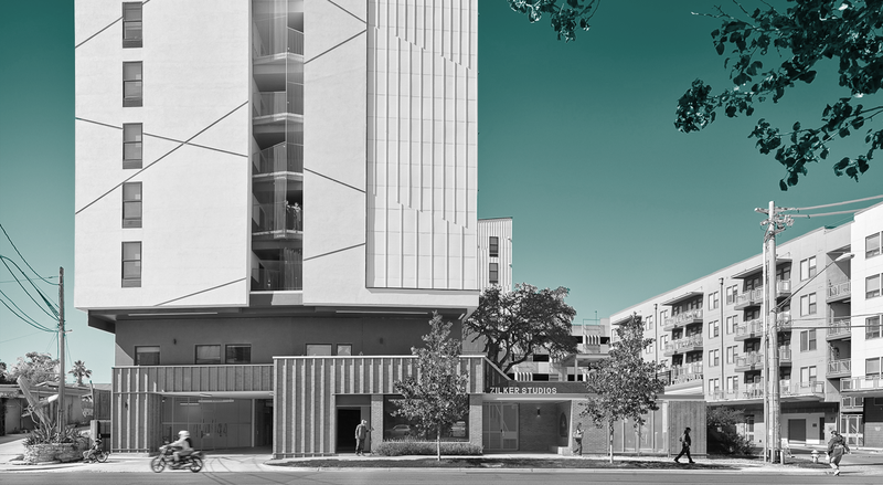 Multistory apartment buildings sit next to each other with a modern geometric facade, under a teal sky.