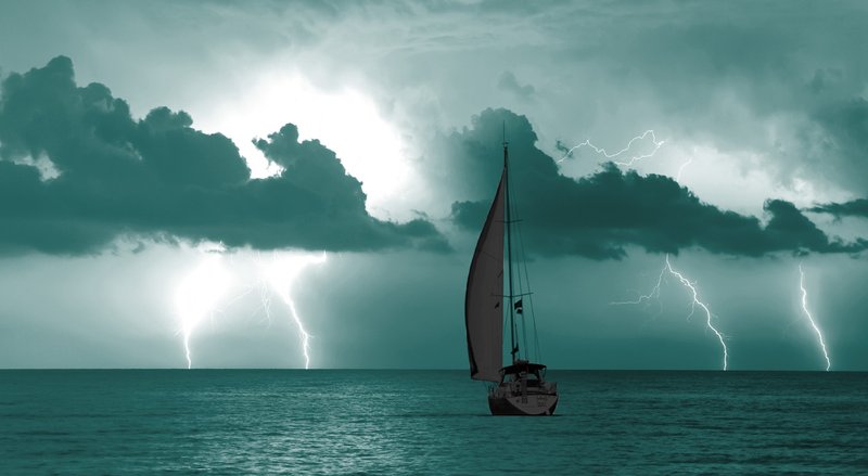A small boat sails on the ocean horizon under a lightning-streaked sky, all beneath a teal overlay.