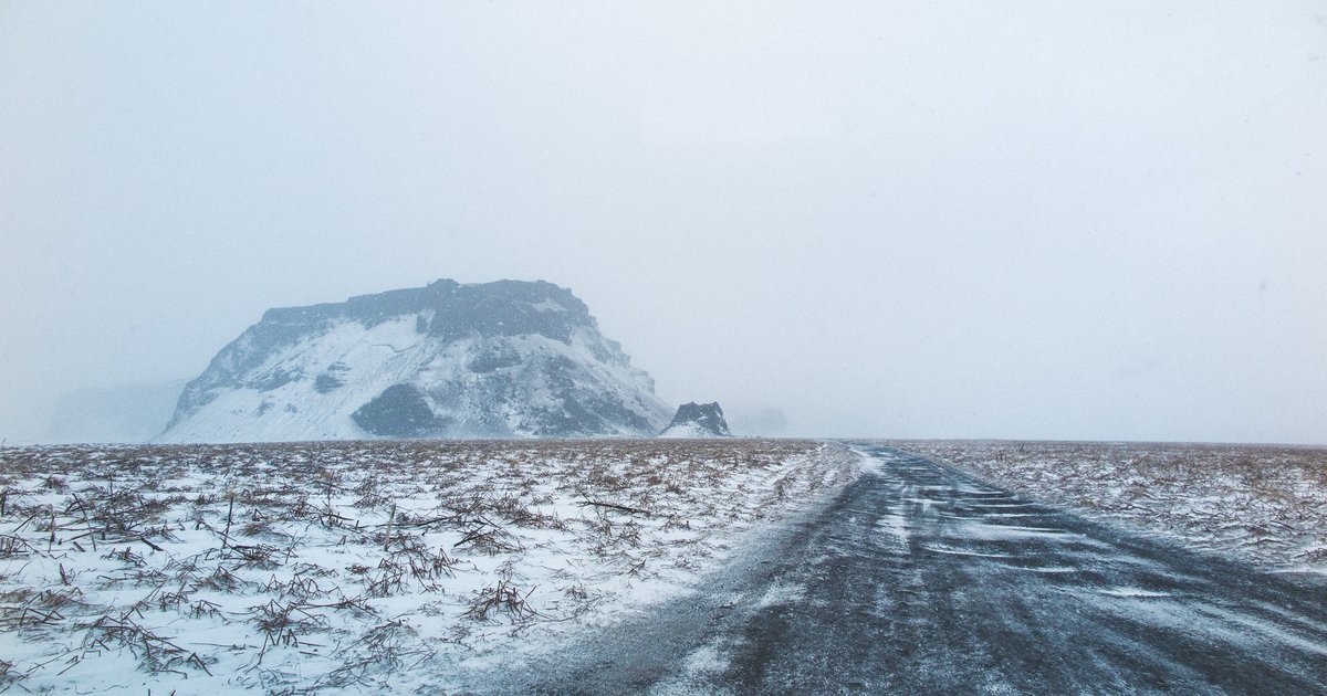 Winter road with foggy horizon