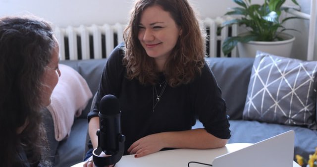 women taping podcast