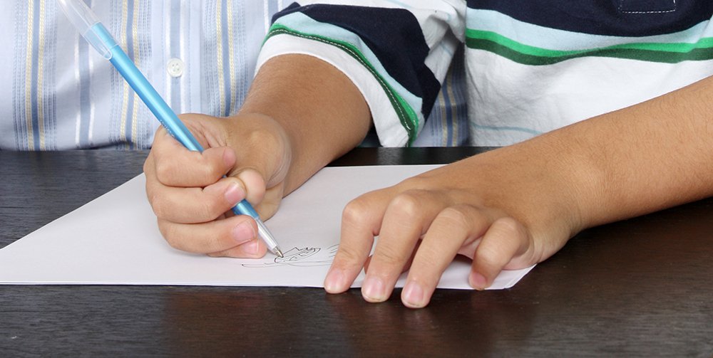 Dual language learner hands writing