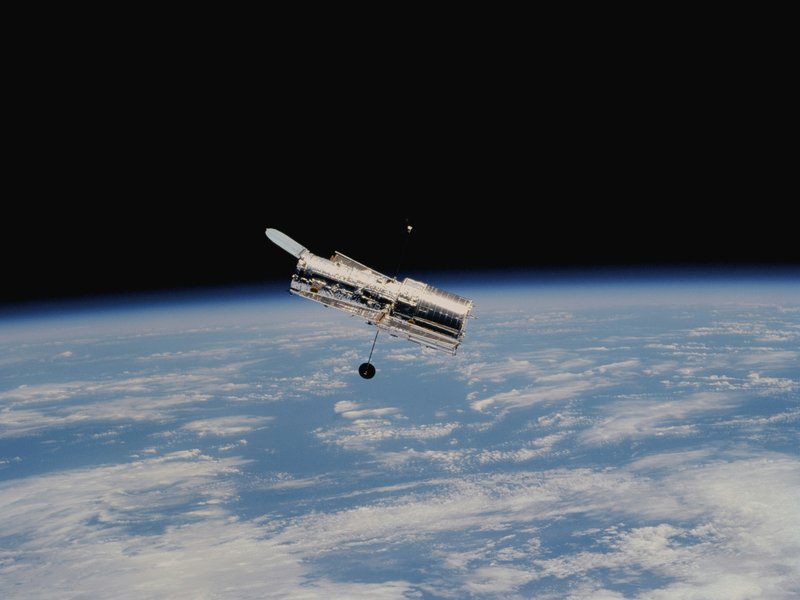 A satellite floats above the earth.