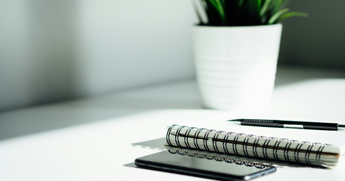 notebook and phone on desk