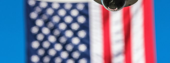 Security camera in front of American flag