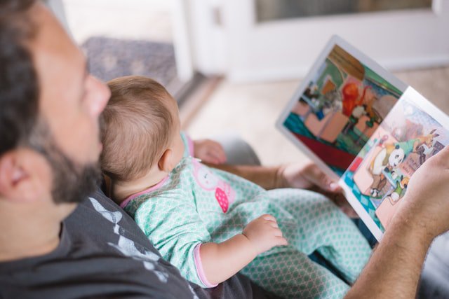 dad reads story to baby