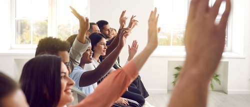 public meeting raised hands