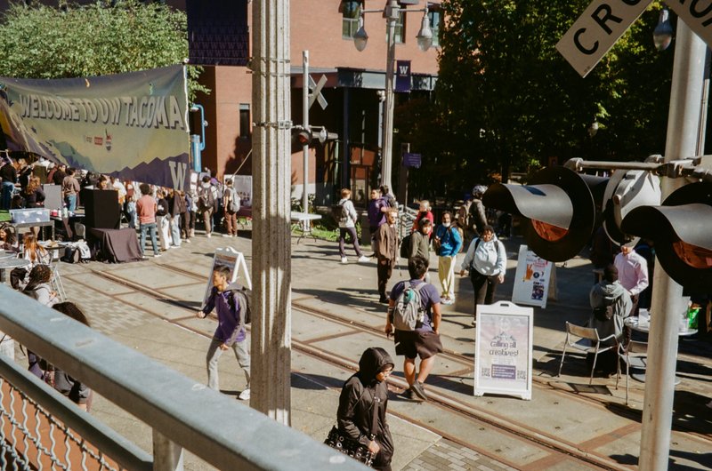 Students walking through a campus event at UW Tacoma.