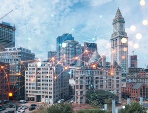 Data points flicker and connect across the Boston skyline.