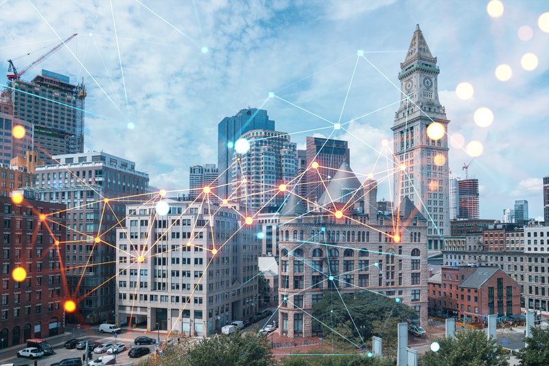 Data points flicker and connect across the Boston skyline.