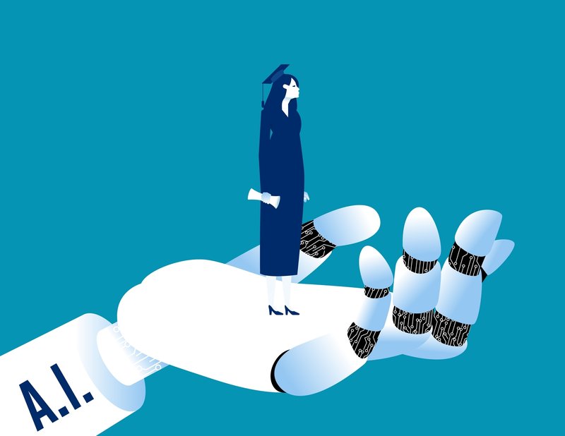 Person with a graduation cap standing on top of a robotic hand that says "A.I." on it.