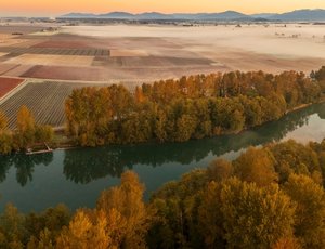 "Aerial view of the Skagit River Valley during a beautiful and dramatic autumnal sunrise." - via Shutterstock