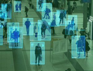 People walk through a space and a camera tracks their moves.