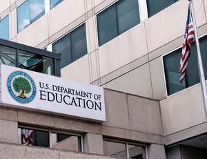White building with Department of Education sign
