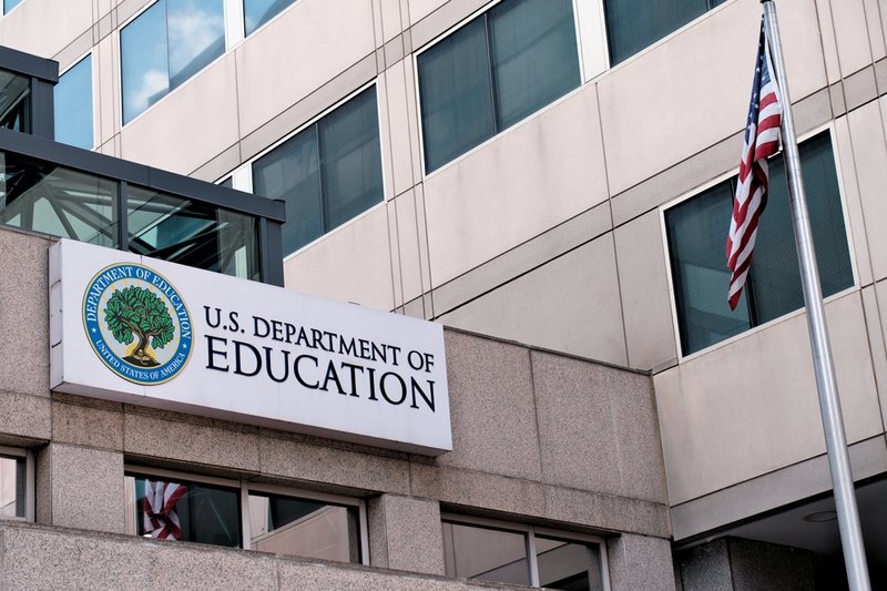 White building with Department of Education sign
