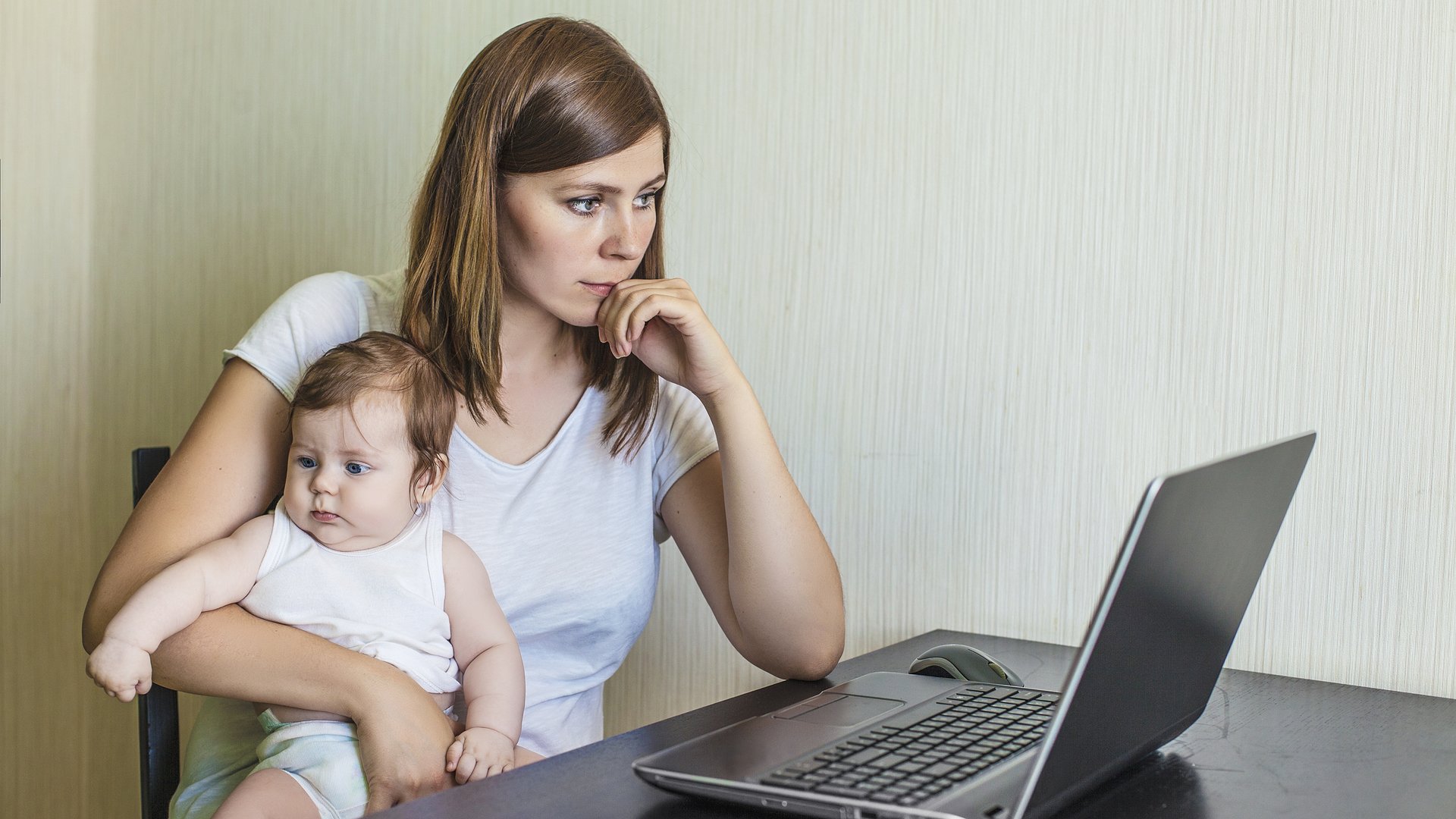 Stressed mom holding baby