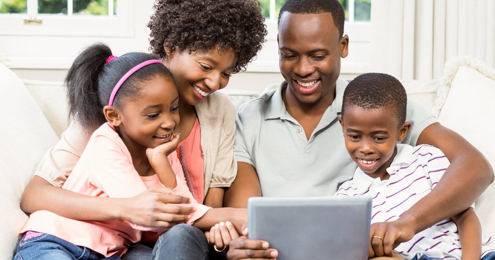 family looking at iPad 3