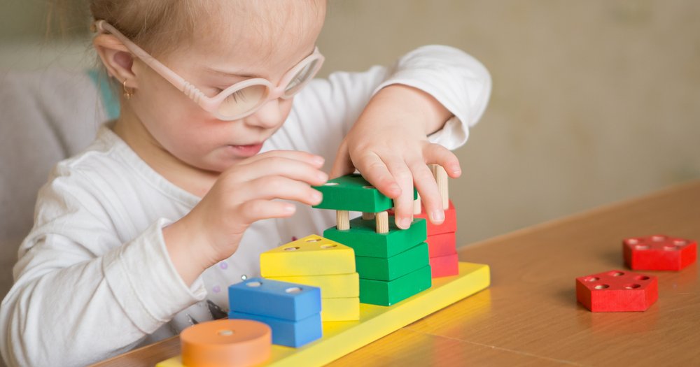 early intervention, child playing with blocks shutterstock_377189251