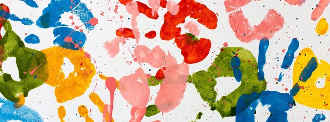Many colored handprints on a white background.