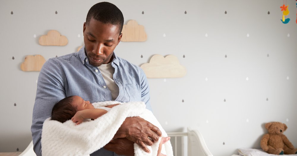 Father caring for a newborn baby