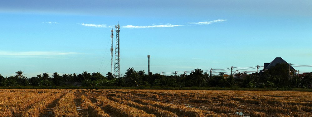 Telecom tower in field