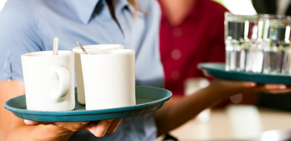 Waitress carrying drinks fast food